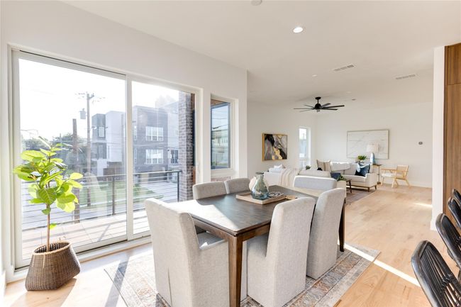 Dining space with ceiling fan and light wood-type flooring | Image 18