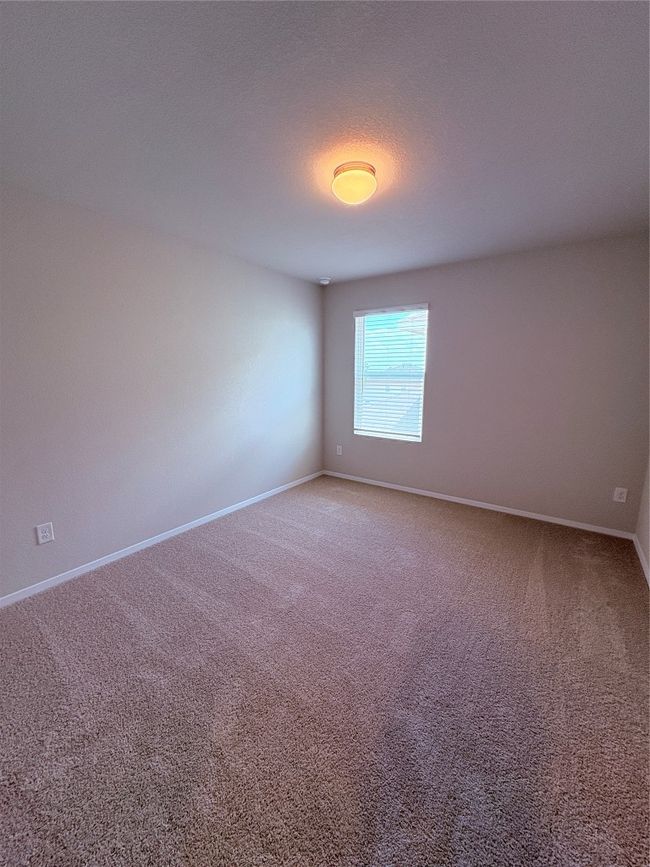 Carpeted empty room with baseboards | Image 21