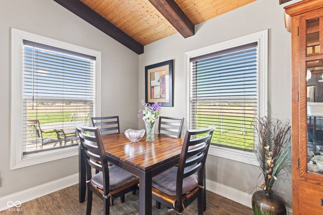dining area vaulted ceiling with beams, and a wealth of natural light | Image 14