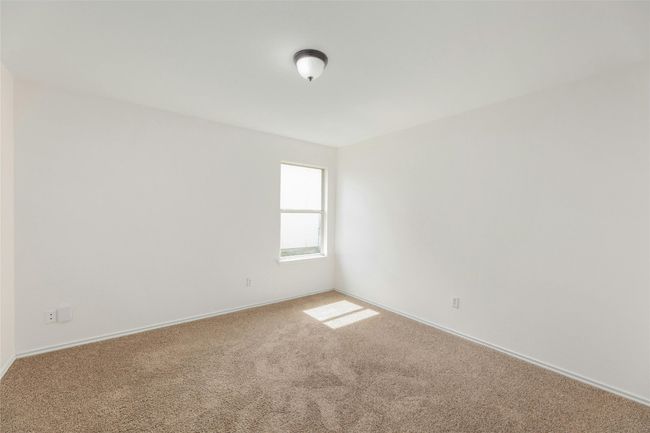 Unfurnished room with carpet floors and baseboards | Image 11