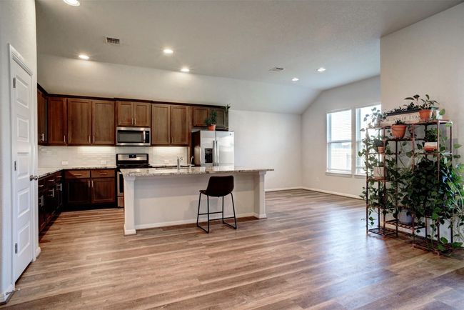 The open floor plan makes it easy to stay engaged with others in the home. | Image 10