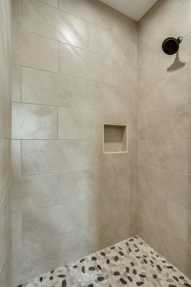 Bathroom featuring tiled shower | Image 18