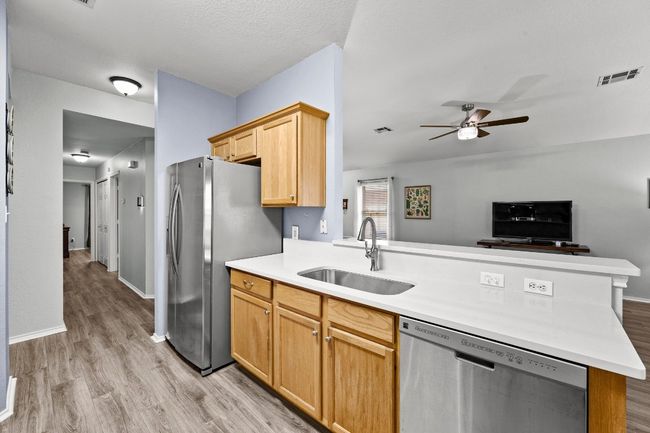 Kitchen featuring appliances with stainless steel finishes and gas range | Image 8