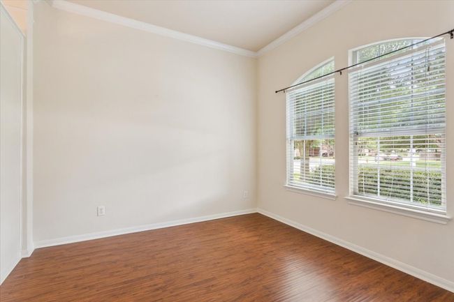 Spare room featuring wood finished floors and ornamental molding | Image 29