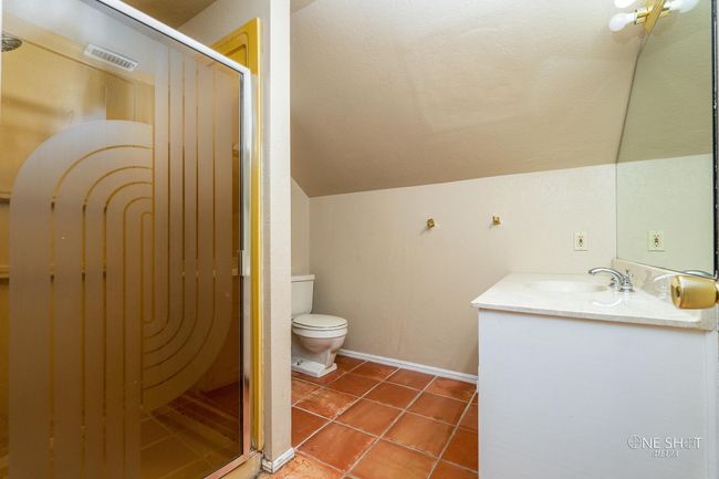 Bathroom with vaulted ceiling, vanity, walk in shower, toilet, and tile patterned floors | Image 27