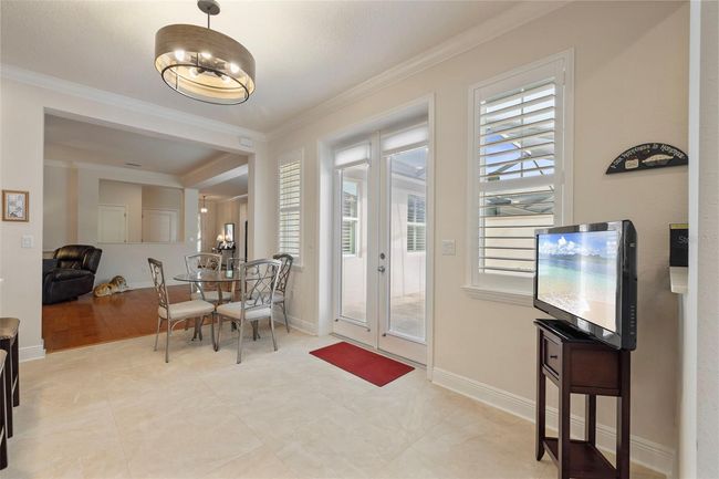 Eat-in kitchen area with doors to the private courtyard-View 1. | Image 20