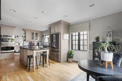 An updated kitchen with custom cabinetry brings this home to modern day living - all with loads of charm. | Image 3