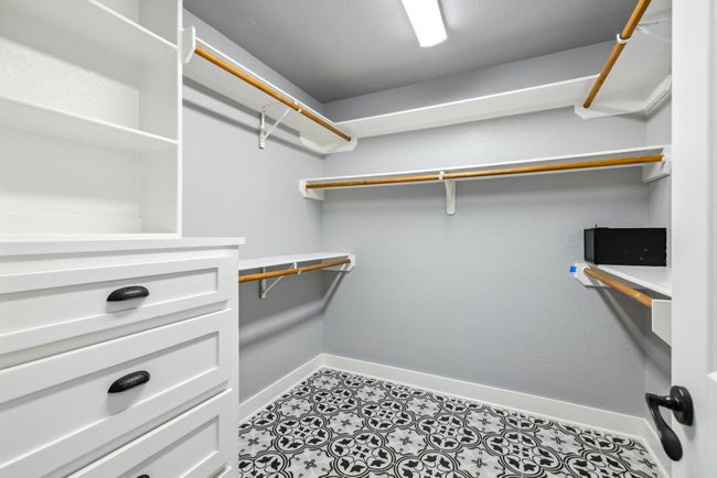 Large walk in closet with lots of storage space | Image 30