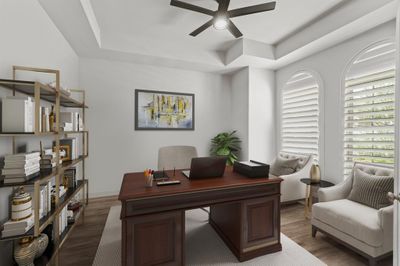 Virtually Staged: Conveniently located at the front of the home is this beautiful Home Office with engineered wood floors, tray ceiling with a ceiling fan, and two windows with shutter blinds. | Image 2