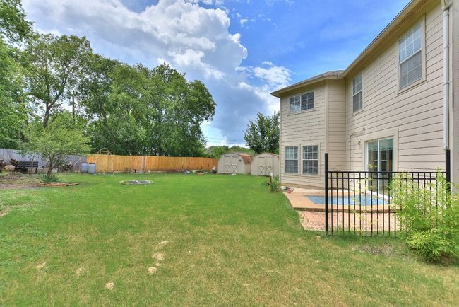 Exterior back of home...just look at the size of that yard! No neighbors behind! | Image 32