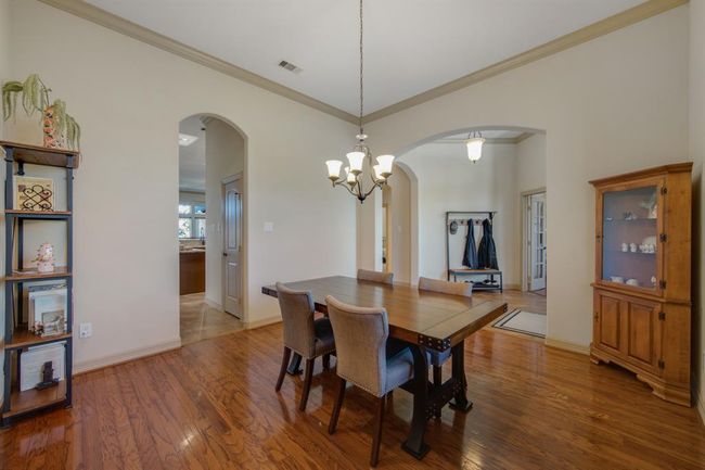 Another view of the formal dining room shows off the arched entrances | Image 6
