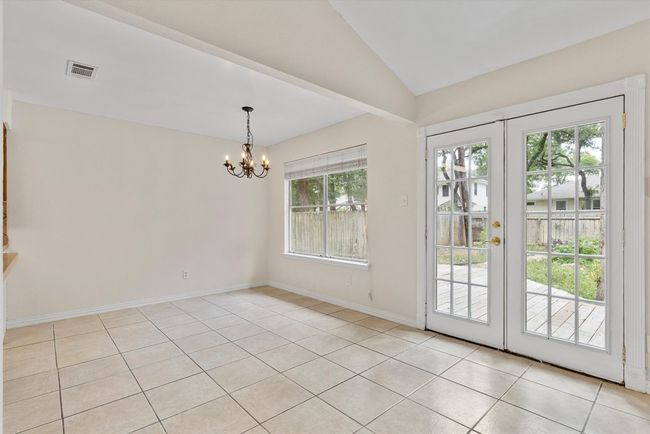The dining area offers a bright and airy space, with plenty of room for gatherings, and a seamless connection to the living room and kitchen for easy entertaining | Image 6