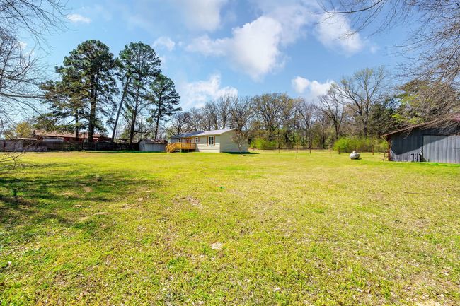 View of yard featuring an outdoor structure | Image 8
