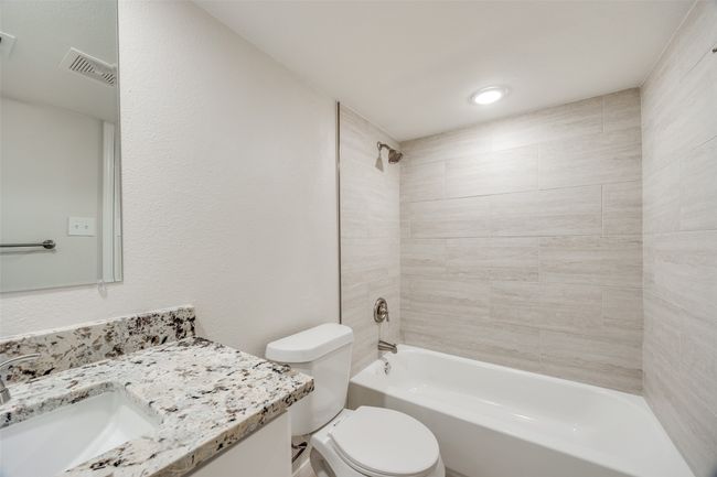 Full bathroom featuring vanity, toilet, and tiled shower / bath combo | Image 20