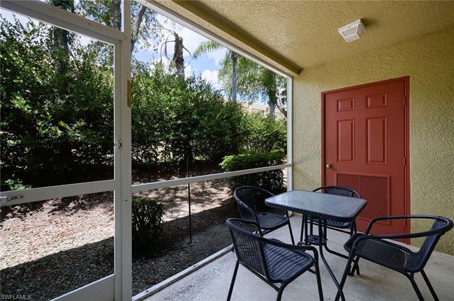 Sunroom featuring outdoor dining area | Image 12