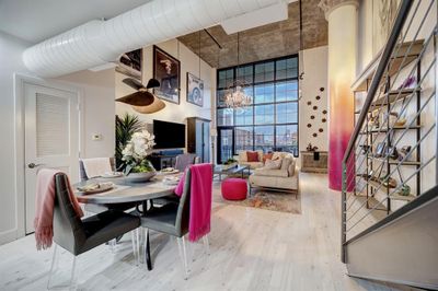 Beautiful open floor plan with new floors and color accents. | Image 1