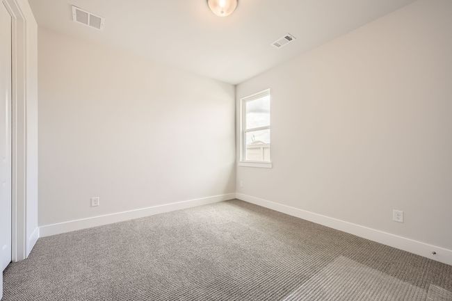 Spare room featuring carpet flooring and baseboards | Image 19