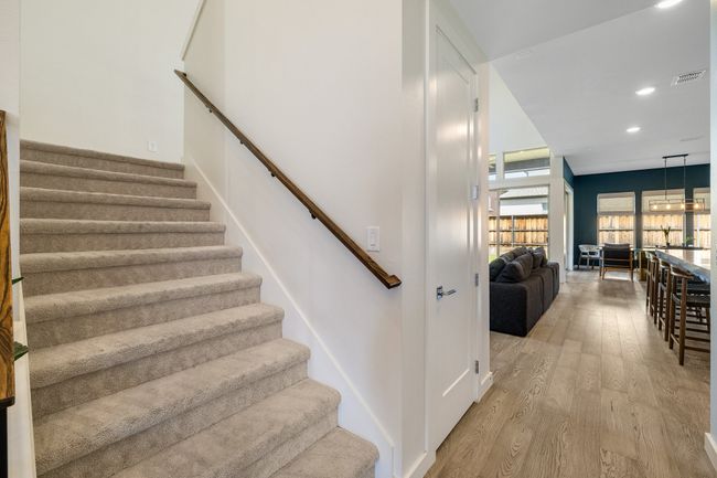 Stairway with wood finished floors and recessed lighting | Image 8