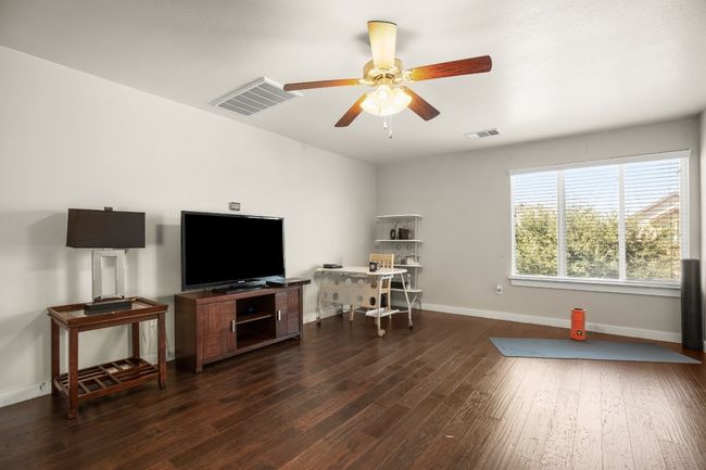 The open layout allows for flexible furniture arrangements, making the room customizable to your needs. | Image 13