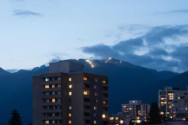 View of city featuring a mountainous background | Image 28