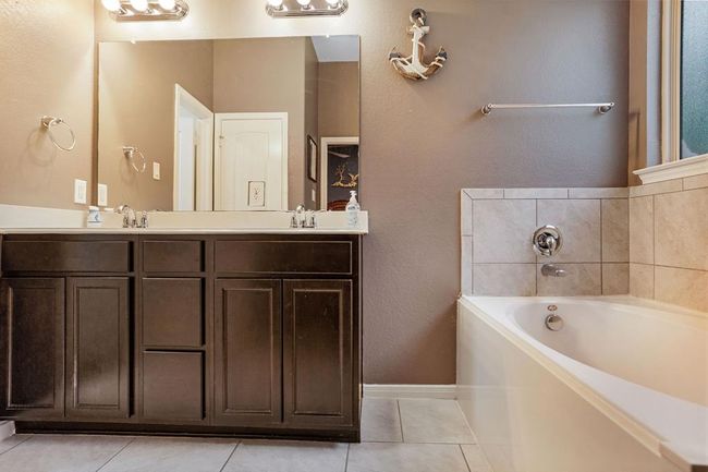 Primary bath has double sinks, soaking tub, shower & walk in closet! | Image 15
