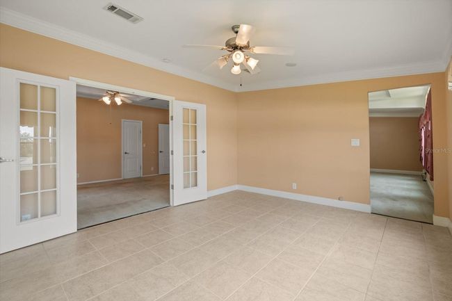 Florida Room looking into Main Bedroom Suite and Living Area. Double French Doors | Image 16