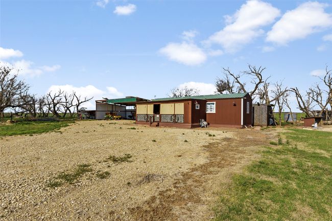 Rear view of property featuring metal roof | Image 15