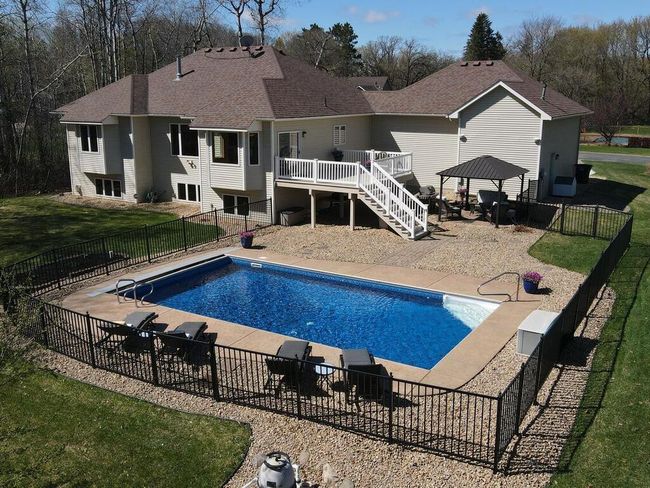 Saltwater Pool with fencing and retractable cover - 25259 Galaxy Ave Wyoming MN 55092 USA-007-070-005-MLS_Size.jpg | Image 4