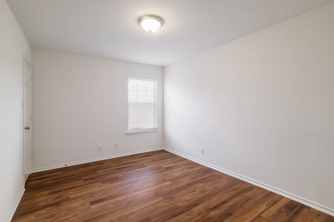 Spare room featuring dark wood-style floors and baseboards | Image 27