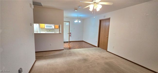 Unfurnished room featuring ceiling fan, carpet flooring, and baseboards | Image 5