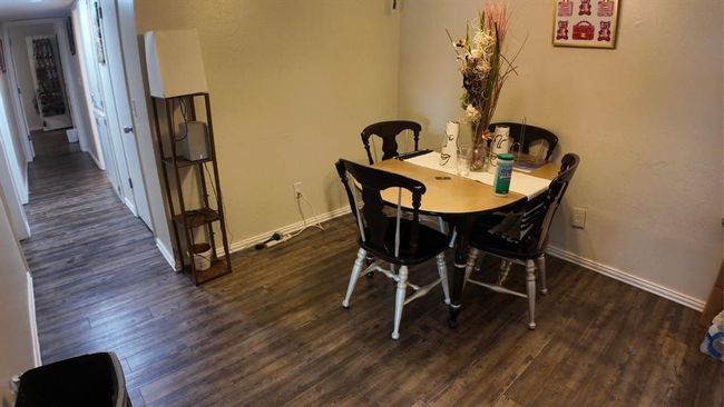 Dining area with wood finished floors | Image 5