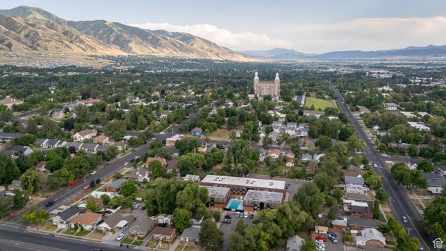 Aerial view of property and surrounding area featuring a mountain backdrop | Image 11