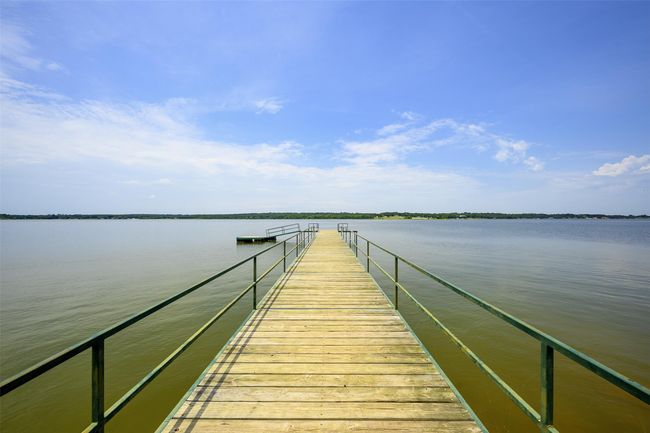 Dock area featuring a water view | Image 14