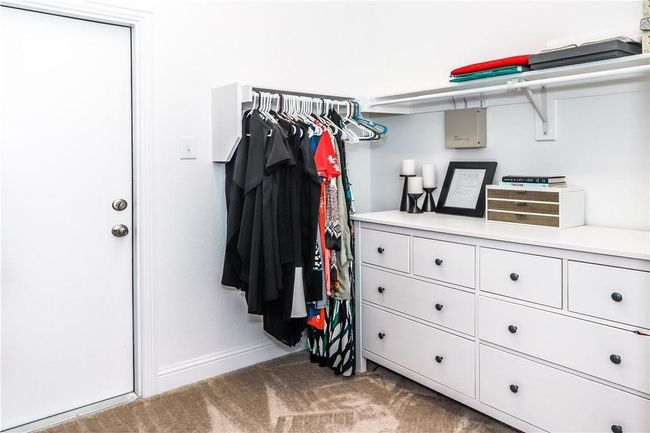 Walk in closet featuring carpet floors | Image 18