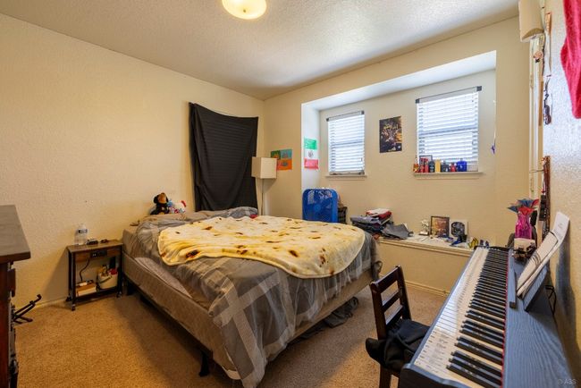 Bedroom with carpet floors and baseboards | Image 15