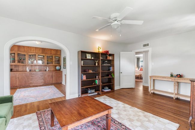 View from living room into dining room - entrance to hallway and bedrooms on the right | Image 7