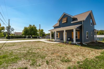 Here you will find a very large driveway with lots of room for parking! Bring your rocking chairs and prepare to unwind and relax on this awesome porch! | Image 3