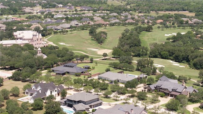 Aerial perspective of suburban area with a golf course | Image 30