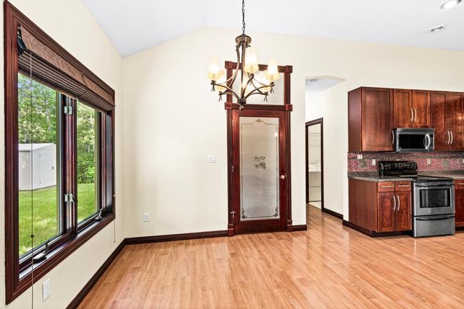 Adjacent to the Kitchen is the Informal Dining Area and the Walk-in Pantry. | Image 13