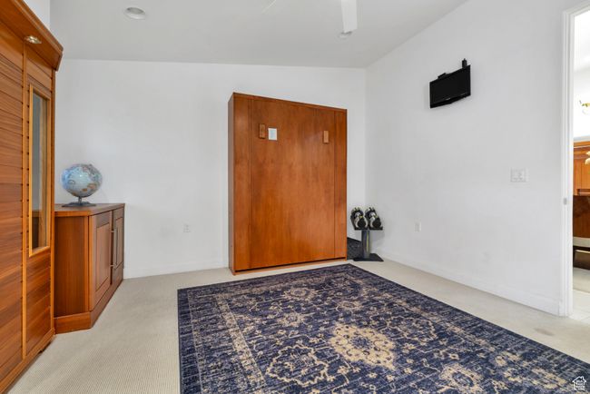 Entryway with light colored carpet and ceiling fan | Image 30