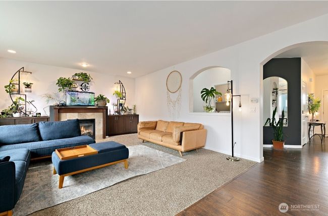 The living room’s gas fireplace brings comfort and style, making it a natural gathering spot year-round. | Image 12