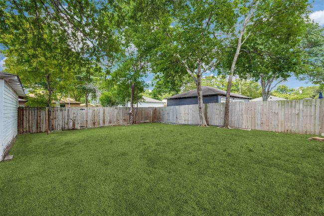 View of fenced backyard | Image 12