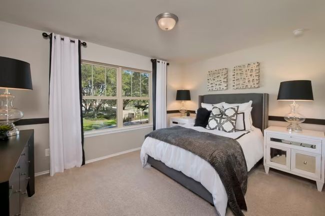 Photo of Pulte model home with same floor plan, not of actual home listed. | Image 12