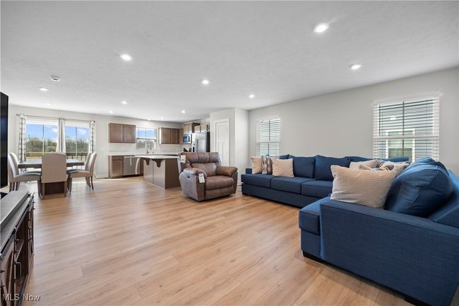 Living room featuring light wood finished floors and recessed lighting | Image 14