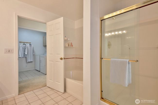 Primary Full bath. Utility room across the way. | Image 18