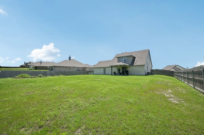 View of fenced backyard | Image 21