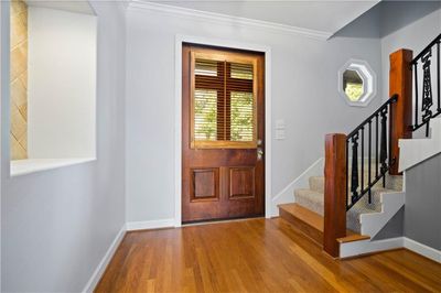 Foyer entrance featuring real hardwood flooring and crown molding | Image 2