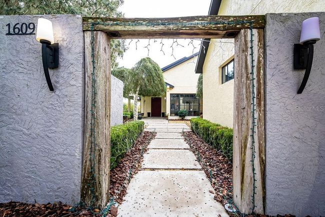 Entryway to the front courtyard and front door | Image 14