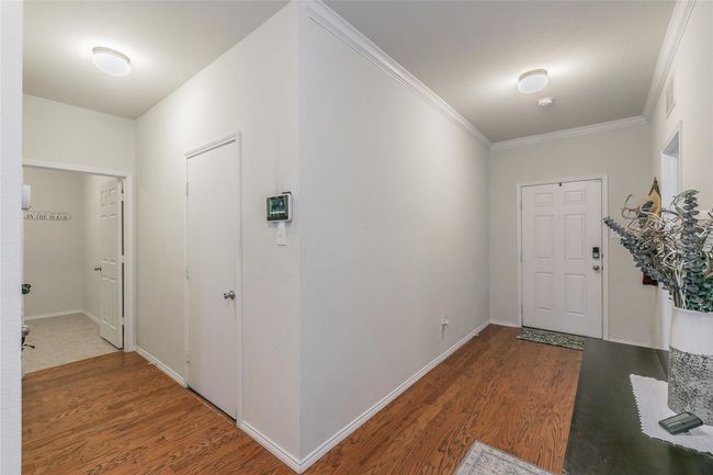 Entrance foyer, garage, & utility room | Image 5