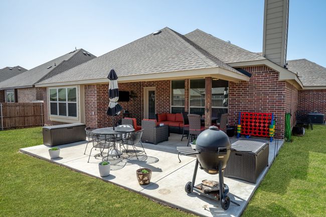 Inviting back patio perfect for grilling and outdoor gatherings | Image 26